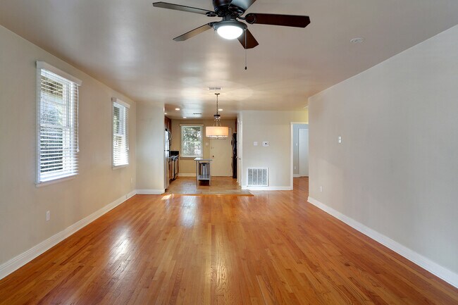 Large living room open to kitchen area - 2718 S Carrollton Ave