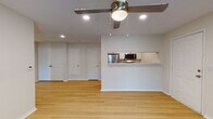 This single-floor, 2-bedroom, 2-bathroom residence in Robinsonville, MS offers a clean, functional layout designed for comfortable everyday living. Light wood-style flooring runs throughout the home, providing a warm and cohesive aesthetic across all rooms.

The open living area features recessed lighting and a ceiling fan, creating a bright and airy atmosphere. A pass-through window connects the living space to the kitchen, enhancing the open feel while maintaining a defined cooking area. The galley-style kitchen is outfitted with white shaker cabinetry, marble-pattern countertops, stainless steel appliances including a refrigerator, range, and microwave, and a stainless steel sink.

Both bedrooms are well-sized, each equipped with a ceiling fan and light-toned walls. The primary bedroom includes direct access to a walk-in closet and an en-suite bathroom. The bathrooms are finished with white cabinetry, marble-style countertops, brushed nickel fixtures, and tub-shower combinations. Upper storage cabinets in both bathrooms add practicality.

Additional utility is provided by a hallway closet and a dedicated storage/utility closet. The neutral color palette and consistent flooring throughout the home create a streamlined, move-in-ready environment.