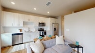 Located at 3606–3612 San Pablo Rd S in Jacksonville, Florida, this single-floor unit offers a thoughtfully designed open-concept layout that integrates the kitchen, dining, and living areas into one cohesive space. Light wood-style flooring runs throughout the main living areas, complementing the bright, neutral color palette that gives the interior a clean and contemporary feel.

The kitchen is a standout feature, outfitted with crisp white shaker-style cabinetry extending to the ceiling for generous storage capacity. Stainless steel appliances—including a range, over-the-range microwave, refrigerator with ice and water dispenser, and dishwasher—provide full functionality. A white subway tile backsplash, stainless steel undermount sink, and light-toned countertops complete the polished look. A window at the end of the kitchen allows natural light to brighten the space.

The living area flows naturally from the kitchen, offering a comfortable and versatile setting. The bedroom is a cozy, well-proportioned retreat featuring carpeted flooring and a high clerestory window that brings in additional natural light. The bathroom is finished with wood-look flooring, a white vanity, and a tiled tub-shower combination, rounding out the unit's practical and modern design.