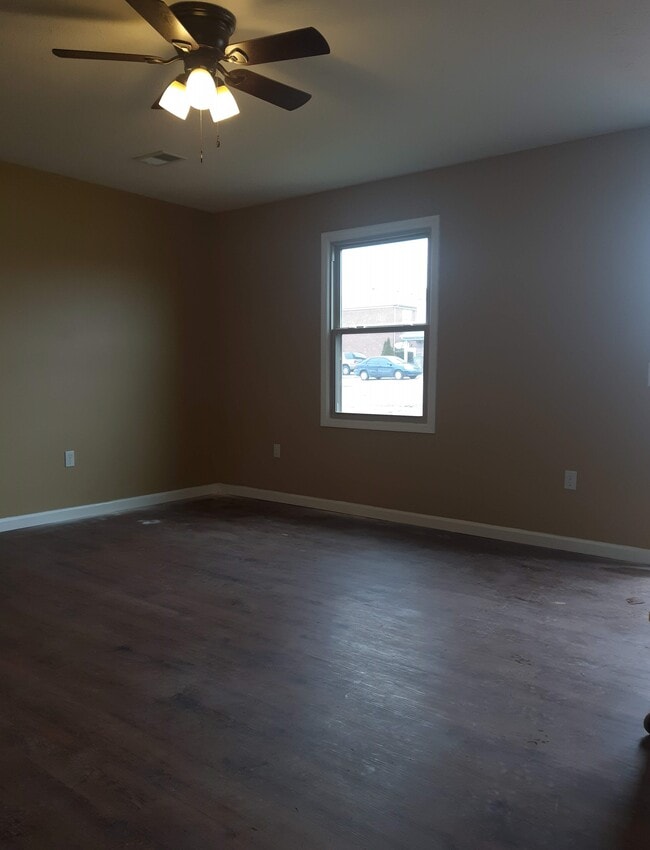 Unit A: Living Room - 306 S Keeneland Dr