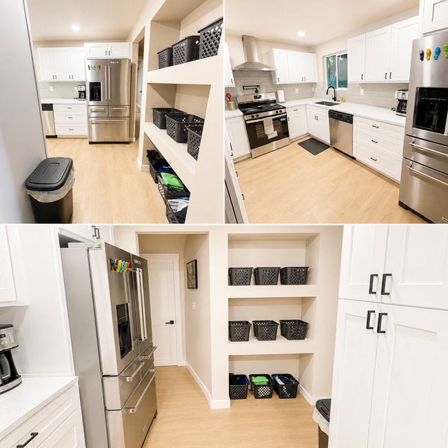 Kitchen w/ stainless steel appliances - 14410 Goodrich Dr NW
