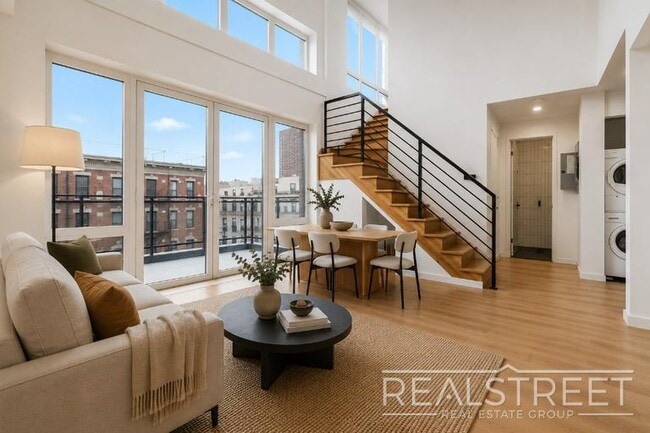 Building Photo - Sun-Filled Penthouse Duplex with Massive Private Terrace & Bonus Storage Room