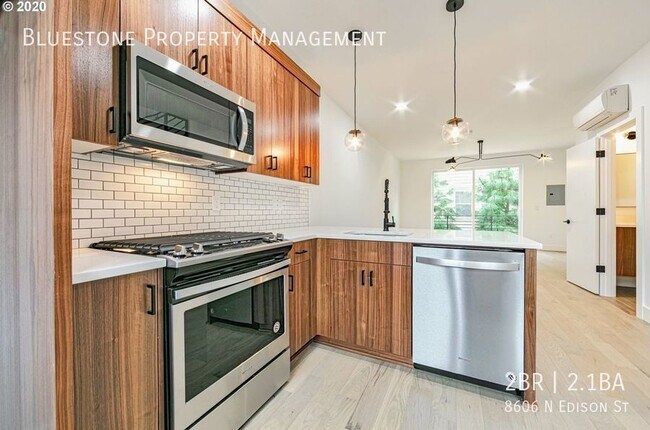 Building Photo - Available Now! Modern Luxury Living in Por...