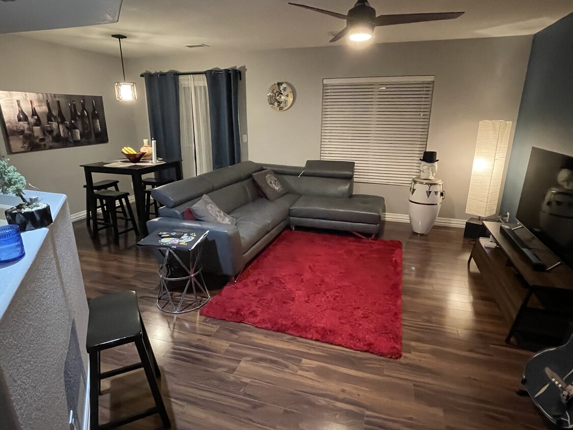 Open concept living room and kitchen - 18717 E 57th Pl