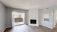 Located at 270 El Dorado Blvd in Houston, TX, this single-floor, one-bedroom, two-bathroom home offers a well-designed layout that maximizes every inch of its space. The open-concept living and dining area serves as the heart of the home, featuring warm wood-style plank flooring, soft gray walls, and a textured ceiling. A white-painted fireplace with a raised hearth acts as a striking focal point, while large sliding glass doors flood the room with natural light and open directly onto a private balcony with outdoor views.

The kitchen is positioned adjacent to the living area, featuring white cabinetry and a pass-through design that maintains the open feel of the main living space. An in-unit laundry area adds everyday convenience.

The bedroom is a comfortable retreat, carpeted for warmth and equipped with a ceiling fan, window with natural light, and direct access to a spacious walk-in closet. The two bathrooms include a full bath with a tiled shower/tub combo and wood-style flooring, and a second bath that boasts a wide white vanity with ample cabinet storage, a framed mirror, and bright overhead lighting. Two closets throughout the home provide generous storage solutions for daily living.
