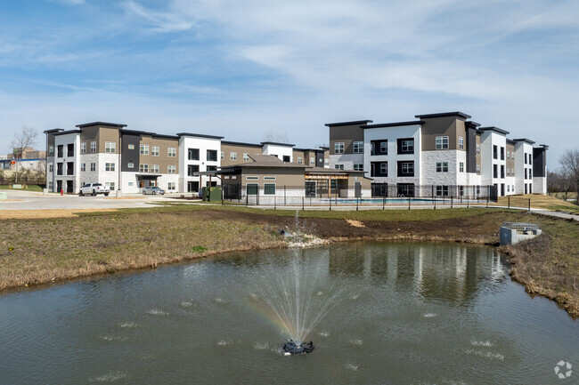 Community with Pond & Walking Trail - The Lofts at Bridgewood