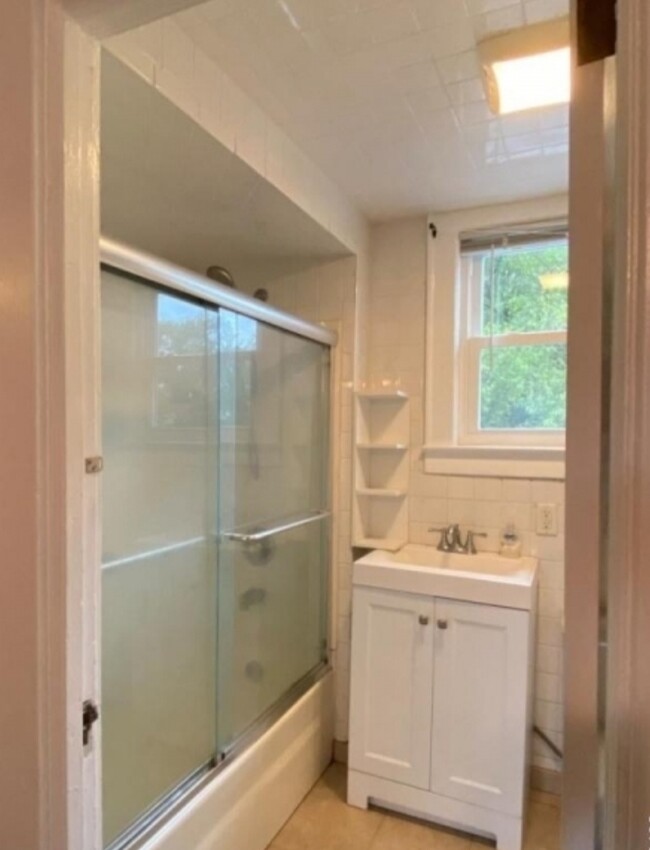 Updated bathroom with shower over tub - 95 Logan Ln