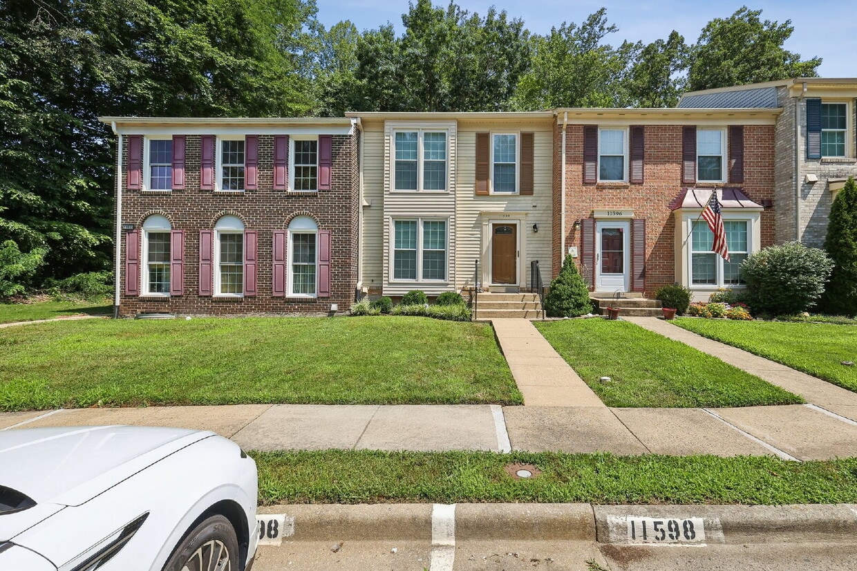 Photo - Welcome to 11598 Overleigh Drive, a beautifully maintained three-level townhome in the highly desira