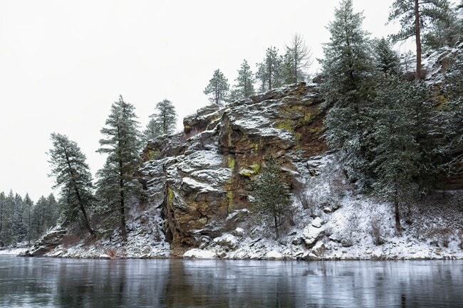 Rocky cliffs meet the Spokane River near Post Falls.