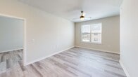 Located at 2400 Linden Dr in Denton, TX, this well-appointed one-bedroom, one-bathroom residence offers a clean, contemporary design across a single thoughtfully organized floor. Light wood-look plank flooring runs throughout the entire unit, creating a cohesive and bright aesthetic in every room.

The open-concept kitchen and living area serves as the heart of the home. The kitchen features white shaker cabinetry, granite stone countertops, a peninsula with an undermount sink, and a full suite of stainless steel appliances including a range, microwave, refrigerator, and dishwasher. Recessed lighting and a subway tile backsplash add refined detail to the space.

The living area flows naturally from the kitchen, offering a versatile, open layout with neutral walls and natural light from a nearby window. The spacious bedroom includes a ceiling fan with light fixture, a large window with exterior views of the surrounding community, and direct access to both the closet and the full bathroom.

The bathroom is finished with white subway tile surrounding the soaking tub and shower combination, a white vanity with granite countertop, brushed nickel hardware, and wood-look tile flooring that ties seamlessly into the rest of the unit's design. A dedicated closet provides additional storage.