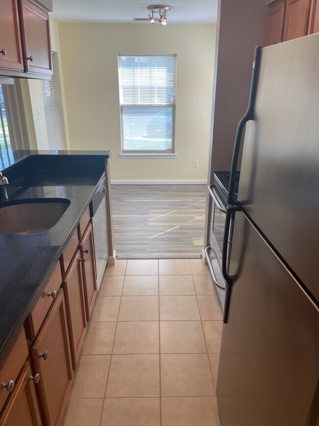 Kitchen looking into dining area - 11710 Olde English Dr