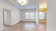 Located at 3715 W 1st St in the heart of Los Angeles, CA, this single-floor unit offers a clean, modern aesthetic throughout. Light wood-style flooring flows seamlessly across all living areas, creating a cohesive and bright atmosphere. The living area is open and airy, featuring white walls, window blinds that allow natural light to filter in, and flush-mount ceiling lighting. An open layout connects the living space to the kitchen, which is well-appointed with white shaker-style cabinetry, warm wood butcher block countertops, a stainless steel sink, a gas range with an over-the-range microwave, and a subtle mosaic tile backsplash that adds textural interest. The bedroom is generously proportioned with large windows fitted with blinds, clean white walls, and access to a closet. The bathroom features classic white subway tile surrounding a full soaking tub with shower, a window for natural ventilation, a pedestal sink, and a black-and-white patterned tile floor. Throughout the unit, crisp white walls and consistent flooring lend a fresh, move-in-ready feel well-suited for urban Los Angeles living.