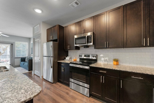 Modern Kitchen with Island & Open Living Room | Discovery Park, Denton TX - Discovery Park Apartments