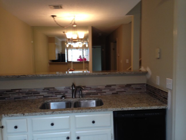 Kitchen into Dining - 103 Williamsburg Cir