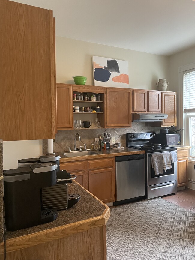 Large kitchen with stainless steel appliances - 1617 W Grace St