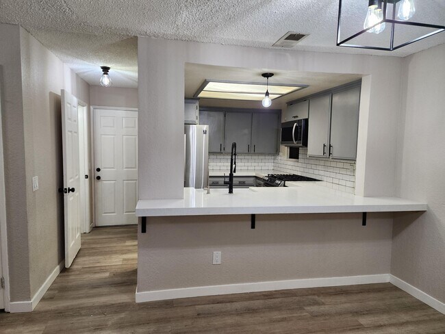 View of Kitchen and Downstairs 1/2 Bath from Living Room - 3749 W El Segundo Blvd