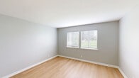 Located at 2044 Georgian Way in Lexington, Kentucky, this single-floor, 2-bedroom, 3-bathroom home offers a clean, modern aesthetic with thoughtfully updated finishes throughout. The open layout connects the living room and kitchen, creating a cohesive and functional living space.

The kitchen stands out with crisp white cabinetry, sleek black hardware, marble-look countertops, a classic white subway tile backsplash, and stainless steel appliances — including a range and built-in microwave. A matte black faucet anchors the sink, adding a contemporary touch.

The living room is spacious and bright, featuring light wood-tone flooring and soft gray walls that carry a consistent palette throughout the home. Natural light filters in through multiple windows, enhancing the airy feel of the space.

Both bedrooms are well-sized, with the primary bedroom offering a generously proportioned layout, plush carpeting, a closet, and direct access to a bathroom. The second bedroom also features carpet flooring and ample room.

All three bathrooms are finished in a modern style, with white vanities, LED-backlit mirrors, black fixtures, and light wood-tone flooring. One bathroom includes a full tub-shower combination. The overall ambiance is fresh, neutral, and move-in ready.