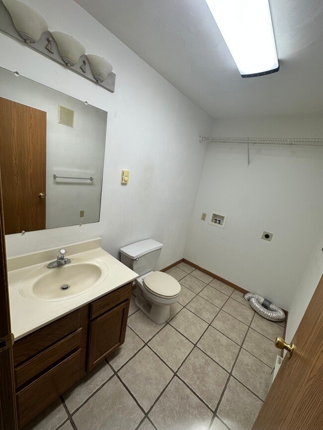 Half bath and utility hookups downstairs - 1056 Lakeshore Dr