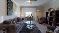 Located at 2325 Nashville Pike in Gallatin, Tennessee, this single-floor residence offers a well-organized layout designed for comfortable everyday living. The open-concept living and dining area is anchored by wood-look flooring, crown molding, and a ceiling fan, creating a bright and welcoming atmosphere. A dedicated study nook off the main living space features hardwood-style flooring and a large window that fills the area with natural light, making it ideal for a home office.

The kitchen is thoughtfully designed with white shaker cabinetry, subway tile backsplash, stone countertops, and a full suite of stainless steel appliances, including a range, refrigerator, and dishwasher. The layout maximizes functionality while maintaining a clean, contemporary aesthetic.

The primary bedroom is carpeted for comfort and includes a generous walk-in closet with wire shelving, providing ample storage. A second bedroom also features plush carpet and windows with outdoor views. Both bathrooms are well-appointed with undermount sinks, stone countertops, white cabinetry, and tub-shower combinations. The overall color palette throughout the residence is neutral and cohesive, lending a calm, modern feel to every room.