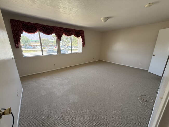Spacious primary suite with double closets, private bath, and mountain view. - 1134 W Huntington Dr