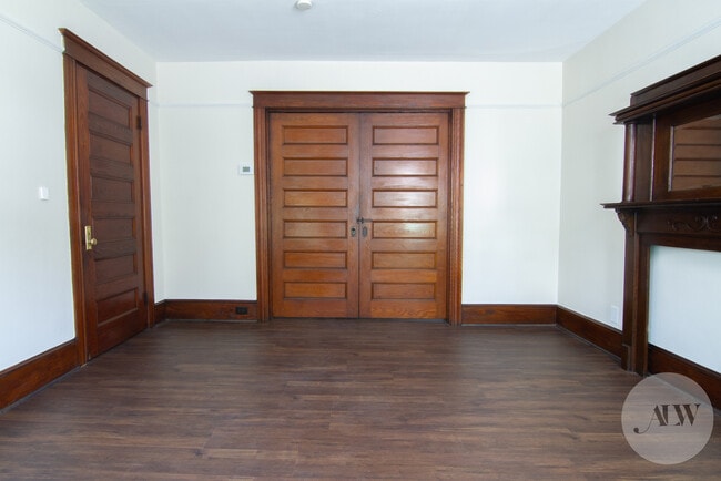 Living Room showing original six-panel pocket doors in closed position - 36 Parker Ave