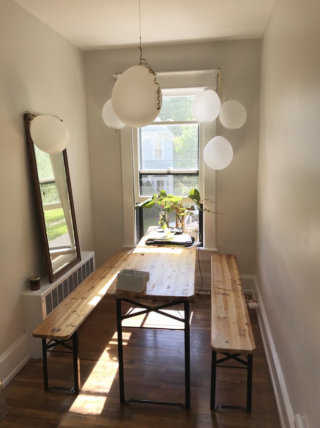 Nook at the end of the hallway makes a great little dining area! - 11 Church St