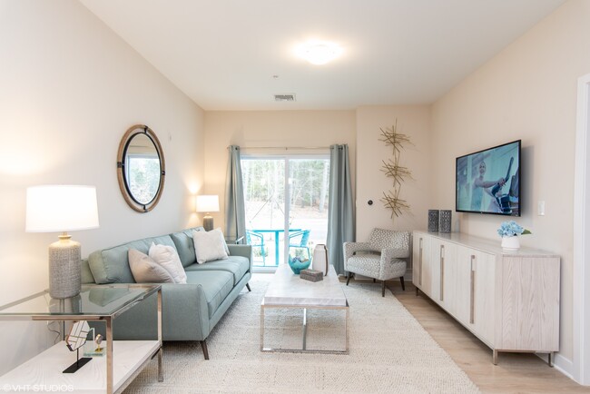 Bright and spacious living area - The Preserve at Great Pond