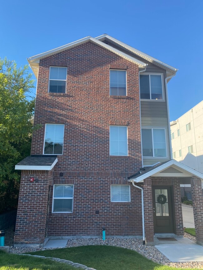 Handsome brick and Hardy exterior. This is the front. Your unit is away from the street. - 361 W Reed Ave
