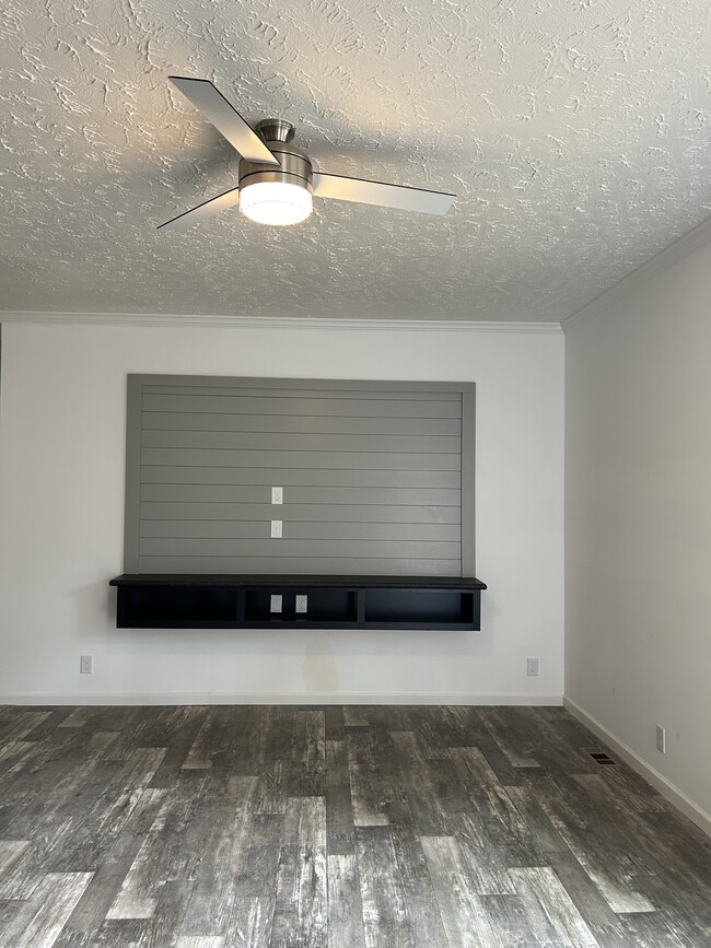 Living room entertainment accent wall - 203 Ridgedale Dr