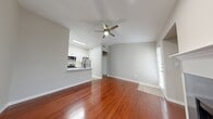 This 710 square foot townhome in Coppell, TX maximizes space with a thoughtful two-floor layout. The main level boasts an open-concept design, featuring a living room with a sleek fireplace and gleaming hardwood floors. The updated kitchen showcases white cabinetry, stainless steel appliances, and a functional island with a modern sink.

The bathroom presents a clean aesthetic with a white vanity, large mirror, and ample storage. The 170 square foot primary bedroom, likely on the upper level, offers a cozy retreat with plush carpeting and natural light from the windows.

Additional amenities include a separate laundry area, two closets for storage, and a staircase connecting both floors. The property's efficient use of space, contemporary finishes, and blend of hardwood and carpeted flooring create a harmonious living environment. Located at 620 North Coppell Rd, this townhome provides urban convenience in a suburban setting.