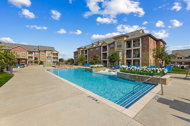 Relax poolside at Auberge of Burleson — where luxury living meets small-town charm. - Auberge of Burleson