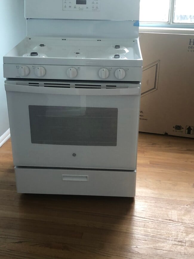 New gas range with overhead Microwave - 5727 S Corning Ave