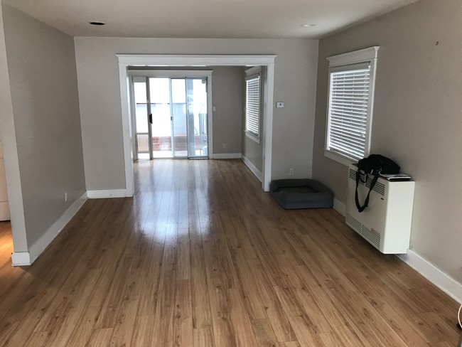 Living-dining areas taken between tenants. Current paint colors may different. - 1622 Bayview Dr