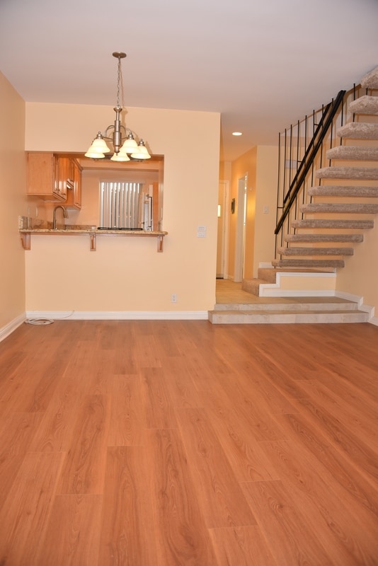 Kitchen and Staircase from LIving Room - 7711 W Manchester Ave