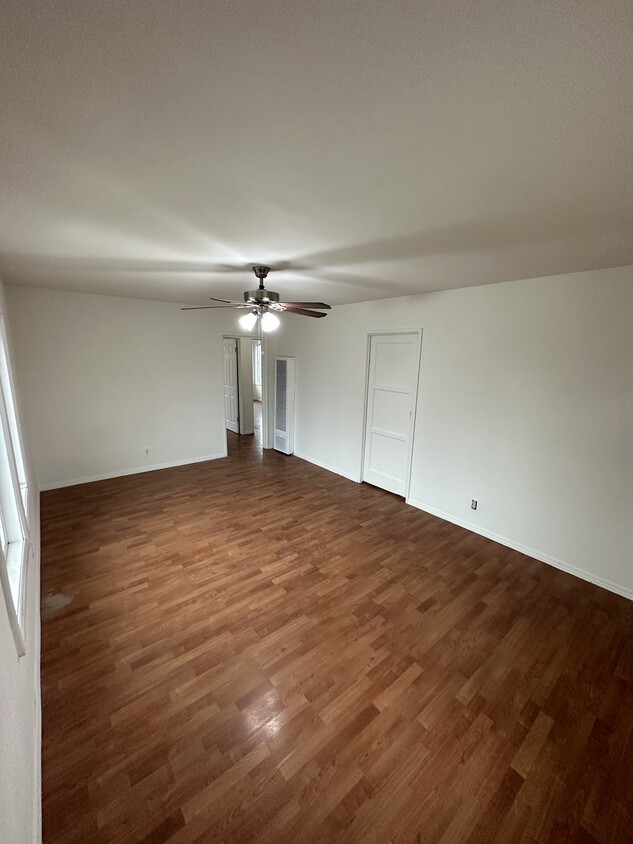 Living room w/ sliding door to kitchen - 3447 Caspian Ave