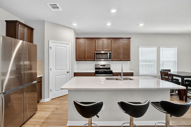 Building Photo - Modern 4-Bedroom Rental in ShadowGlen – Sp...