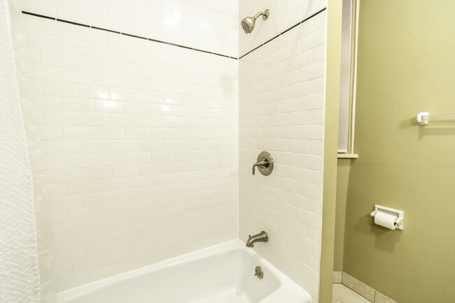 Tiled shower and tiled floor - 252 42nd St