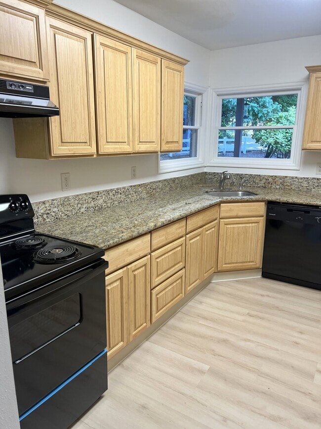 kitchen back to living room - 4662 Carman Dr House