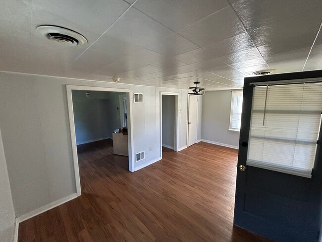 Front room immediately upon entry. Looking into second front room (dining room) - 429 Camp Strause Rd