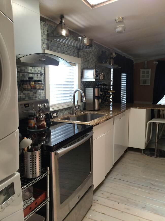 Kitchen open plan with plenty of prep and cook space. Island seating. - 3000 Clarcona Road