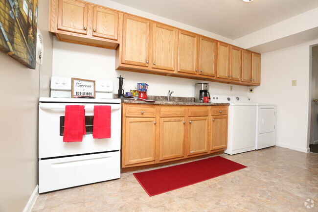 2BR, 1BA - 944 SF - Kitchen With Laundry - Eleven Oaks