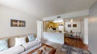Located at 160 N Pantano Rd in Tucson, Arizona, this single-floor residence offers a functional and comfortable layout designed for everyday living. The open-concept living area welcomes you with soft carpeting, a textured ceiling, and a large window fitted with vertical blinds that invite natural light into the space. The living room flows seamlessly into the kitchen and dining area, creating a cohesive, connected environment.

The kitchen features warm oak cabinetry, a full suite of white appliances including a refrigerator and electric range, and a peninsula counter that doubles as a pass-through to the living space. Wood-style flooring in the kitchen and dining area adds a warm contrast to the carpeted living room. A dedicated dining nook provides a cozy spot for meals.

The bedroom is a restful retreat, highlighted by a neutral gray accent wall, carpeted floors, and a window that brings in natural light. A walk-in closet offers practical storage. The textured ceiling carries throughout the room, maintaining design consistency.

Two full bathrooms serve the residence, each featuring a vanity with oak cabinetry, a tub-shower combination, and rich wood-style flooring. The clean, neutral palette throughout keeps the space feeling bright and well-maintained. Overall, this residence provides a practical, comfortable layout in a convenient Tucson location.