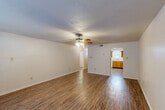 Located at 2300 General Meyer Ave in New Orleans, this single-story, 2-bedroom, 2-bathroom home offers a practical and well-organized layout. The living room is a generous, open space featuring wood-look hardwood flooring, a textured ceiling, and a ceiling fan with light kit. Natural light filters in through windows with blinds, creating a bright and welcoming atmosphere.

The kitchen is efficiently designed in an L-shaped configuration, outfitted with warm oak cabinetry, ample counter space, a double-basin sink, a gas range with overhead ventilation, and a full-size refrigerator. A dishwasher and pantry provide added convenience, and a secondary entrance connects directly to the kitchen area.

Both bedrooms are carpeted and include ceiling fans with natural light from windows. The primary bedroom offers a comfortable footprint with dedicated closet space. The bathrooms feature oak vanities with light countertops and mirrors. The home includes an impressive five closets throughout, ensuring abundant storage.

Additional highlights include a dedicated laundry area, a hallway connecting the main rooms, and a patio for outdoor enjoyment. The consistent wood-look flooring across common areas ties the layout together, making this a well-appointed and functional home in the Algiers neighborhood of New Orleans.