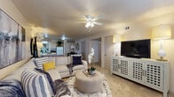 This two-bedroom, two-bathroom residence in Benton, Arkansas offers a well-designed single-floor layout that balances comfort and functionality. The open-concept living room serves as the heart of the home, featuring plush carpet flooring, a textured ceiling, and a ceiling fan with light fixture. Large windows allow natural light to fill the space, creating a warm and inviting atmosphere.

The kitchen connects seamlessly to the dining and living areas, outfitted with light wood cabinetry, a white appliance suite, and a peninsula with bar seating — ideal for casual dining. The adjacent dining area accommodates a full table and benefits from the same hardwood-style flooring that runs through the kitchen.

The primary bedroom is a comfortable retreat, featuring carpet flooring, a ceiling fan, and a large window that brings in ample natural light. Closet storage is generously provided throughout the unit, including a dedicated hallway closet with full-length hanging rods.

Both bathrooms are equipped with tub/shower combos featuring sliding glass doors, light wood overhead cabinetry, and wood-style flooring, offering a clean and practical design. A connecting hallway ties the bedrooms and bathrooms together, completing this efficiently organized and welcoming home.