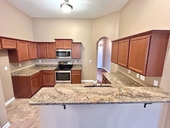 Building Photo - Now Leasing a 4-bedroom 2 bath home in Oli...