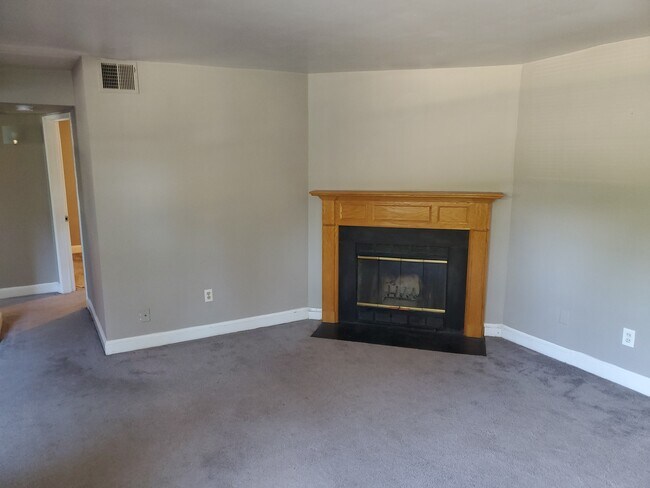 Living Room with wood-burning fireplace - 2111 N Scott St