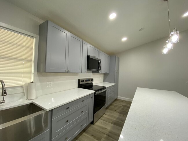 Building Photo - Totally refurbished three bedroom, two bat...