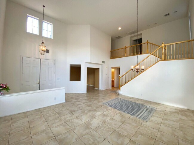 Building Photo - Large family home in the Eldorado Community! Home has a living room with a high ceiling, a den th...