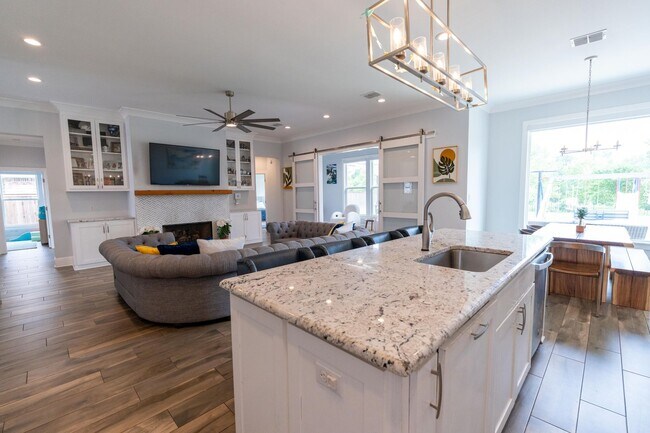 Foto del edificio - Waterfront Dream in Island Park | 4BR Retreat with Fire Pit, Flex Space & Backyard Oasis