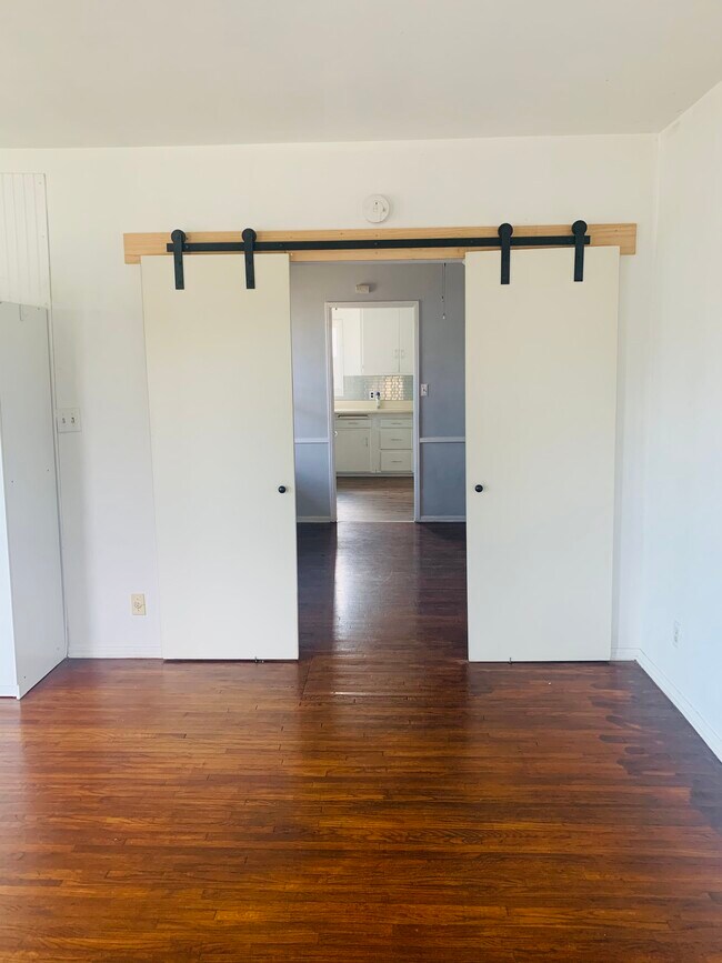 Barn doors in large bedroom - 3723 W 111th St